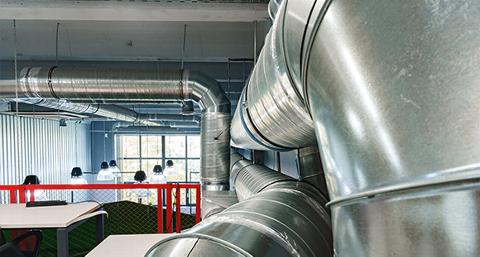 industrial ventilation ducts in modern office interior with workstations and bright lighting 2 efficient air circulation systems